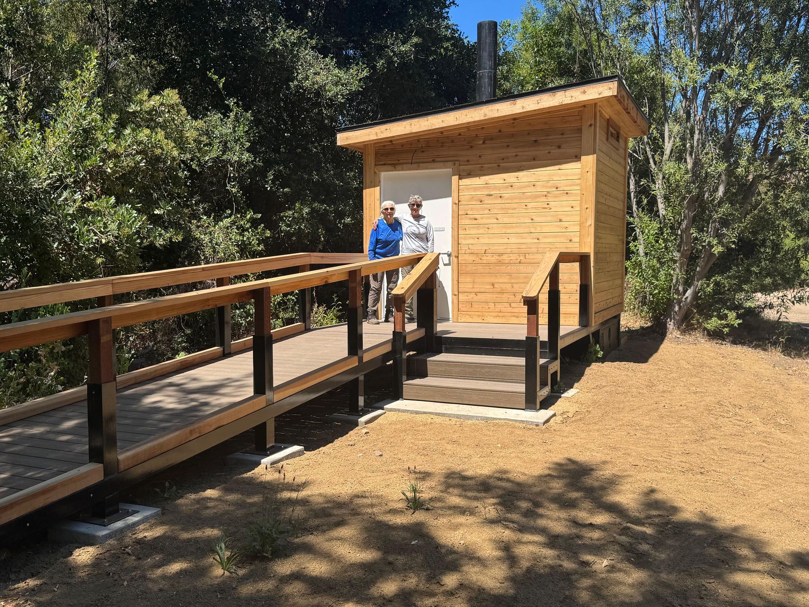 Ruth and Carlyn at newly built restroom